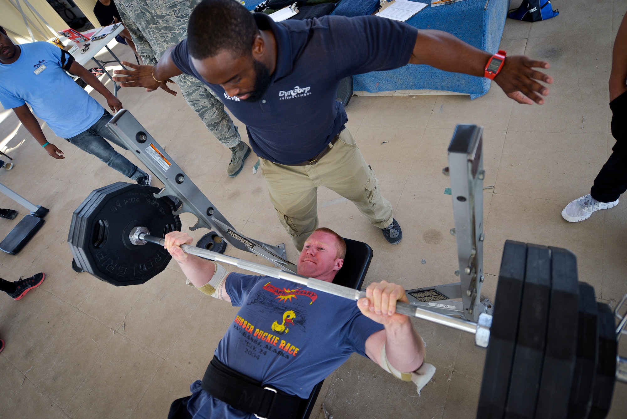 Staff Sgt. Ezra Pitzer bench presses 385 pounds during the first day of the Strongest in the AOR competition at Al Udeid Air Base, Qatar, Jan. 29, 2014. The competition which supports the Air Force’s Fit to Fight program tested the limits of service members in three days with separate lifts to include a bench press, a squat and a deadlift. The competition is still under way and a winner will be determined based on a person’s weight to lift ratio. Pitzer works at the 379th Expeditionary Aircraft Maintenance Squadron and is deployed from Eielson Air Force Base, Alaska. (U.S. Air Force photo/Senior Airman Jared Trimarchi) 