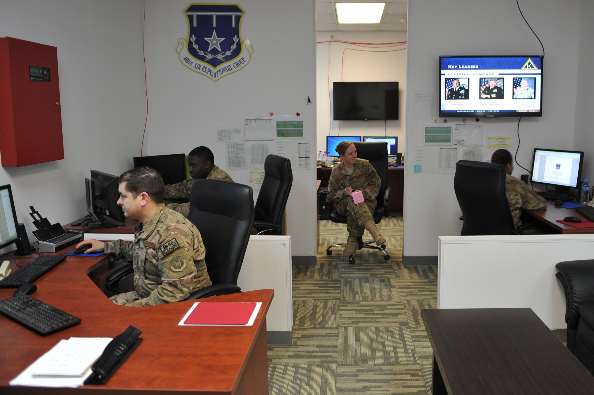 Airmen assigned to the 466th Air Expeditionary Group logistics and operations center update travel and movement schedules for inbound and outbound Airmen at Al Udeid Air Base, Qatar, Jan. 30, 2014. The 466th AEG recently moved from the Transit Center at Manas, Kyrgyzstan to Al Udeid Air Base, Qatar and provides administrative and operational control of all Joint Expeditionary Tasked Airmen and Individual Augmentee Airmen assigned to non-Air Force units executing joint mission sets in support of Operation Enduring Freedom operations throughout Central Commands area of operation. (U.S. Air Force photo by Master Sgt. David Miller)