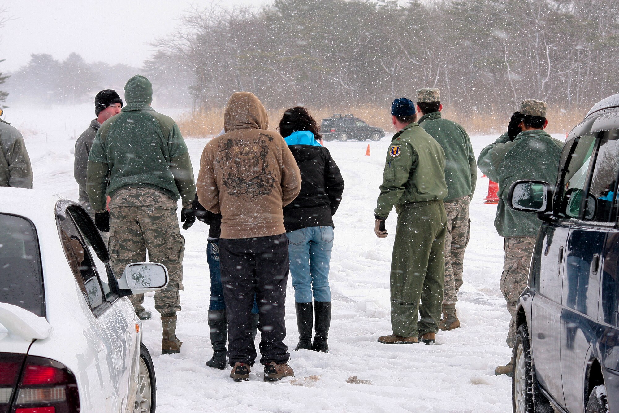 Airmen at watch on as a driver practices safe winter driving techniques at the Slippery Weasel Driving course at Misawa Air Base, Japan, Jan. 31, 2014. (U.S. Air Force photo/Tech. Sgt. Logan McKeown)