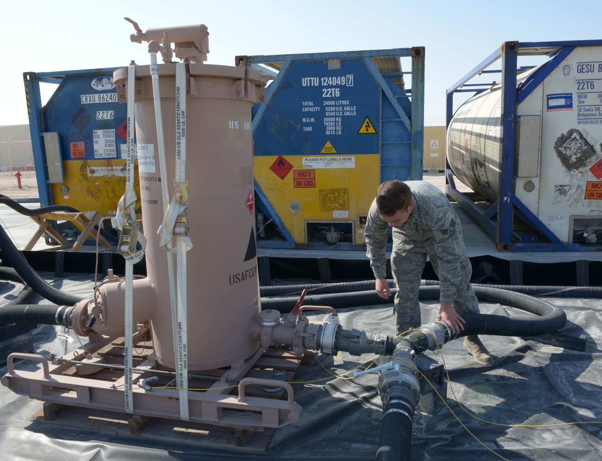 Senior Airman Adam Ranney conducts a daily inspection on transfer hoses and connections on the emergency aviation gasoline equipment at Al Udeid Air Base, Qatar, Jan. 27, 2014. The 379th Expeditionary Logistics Readiness Squadron petroleum, oil and lubricants flight is the only location in the U.S. Air Forces Central Command area of responsibility capable of providing fly away emergency aviation gasoline and must be ready to deploy fuel 24/7/365.  Ranney is a 379th ELRS POL fuels ramp specialist deployed from Ramstein Air Base, Germany, and a Whittier, Calif., native.  (U.S. Air Force photo/Senior Airman Hannah Landeros)