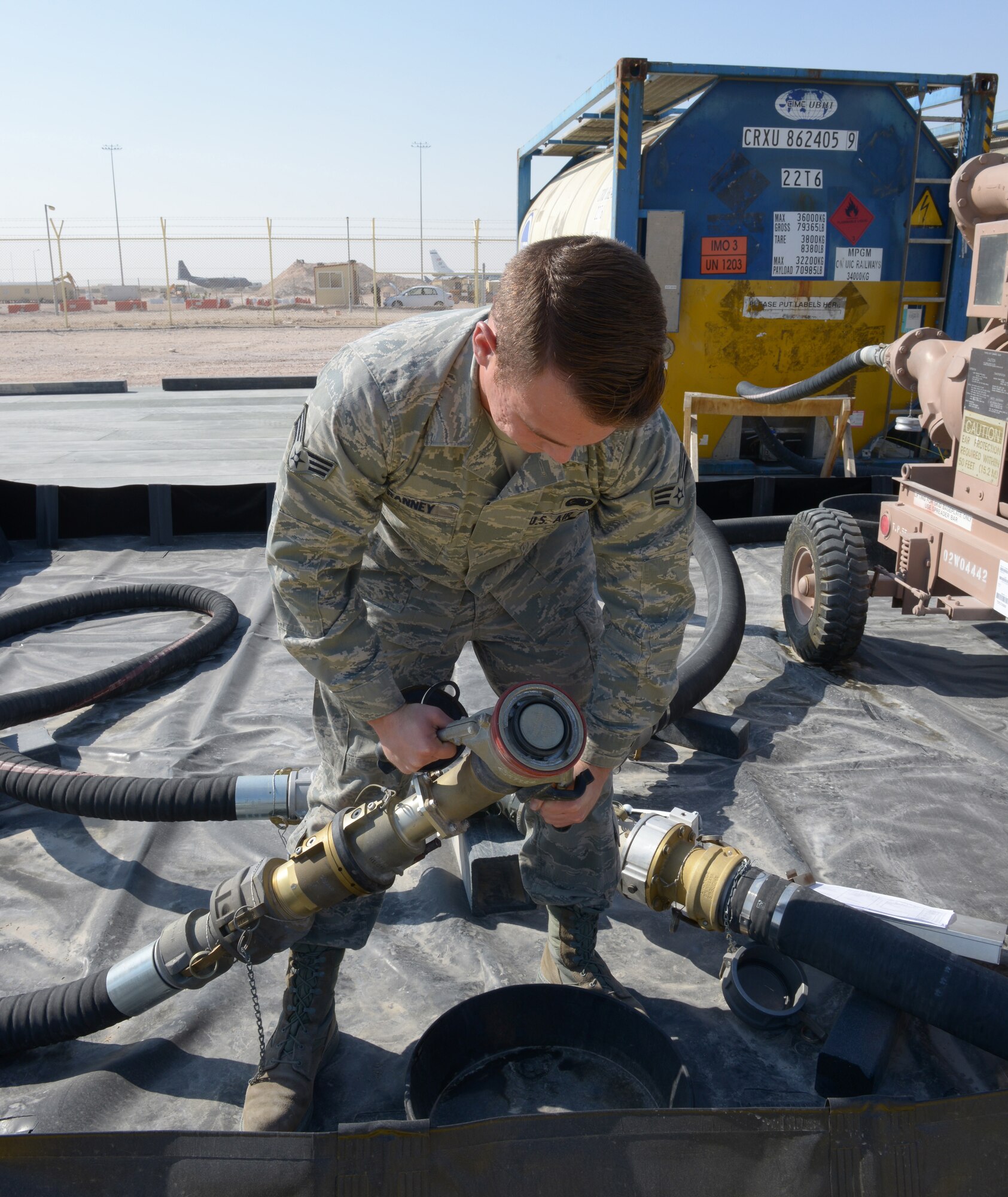 Senior Airman Adam Ranney conducts a daily inspection of a nozzle on the emergency aviation gasoline equipment at Al Udeid Air Base, Qatar, Jan. 27, 2014. The 379th Expeditionary Logistics Readiness Squadron petroleum, oil and lubricants flight is the only location in the U.S. Air Forces Central Command area of responsibility capable of providing fly away emergency aviation gasoline and must be ready to deploy fuel 24/7/365.  Ranney is a 379th ELRS POL fuels ramp specialist deployed from Ramstein Air Base, Germany, and a Whittier, Calif., native.  (U.S. Air Force photo/Senior Airman Hannah Landeros) 