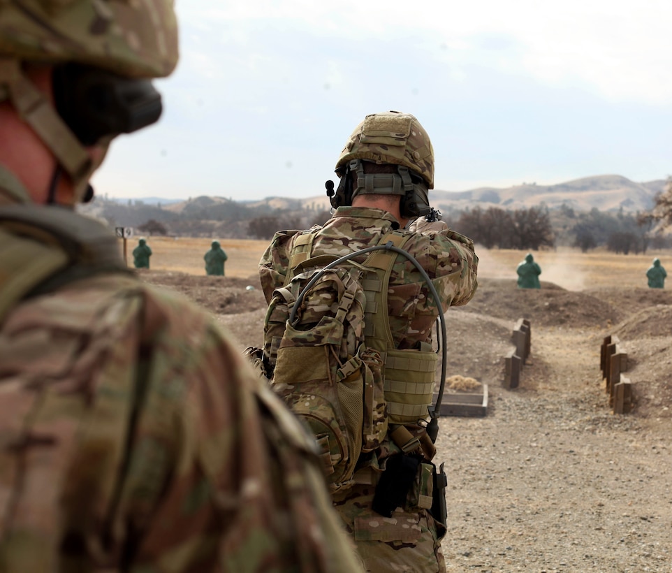 An Army Ranger fires his M9 9mm pistol at targets during weapons qualification at a range on Fort Hunter Liggett, Calif., Jan. 24, 2014.