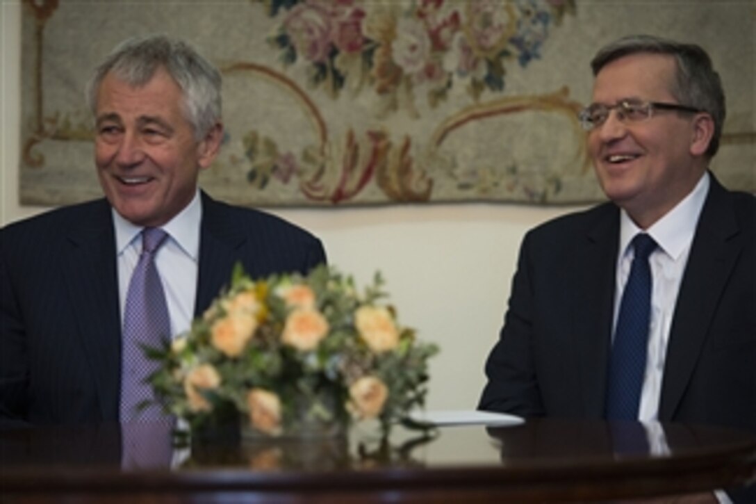 U.S. Defense Secretary Chuck Hagel, left, meets with Polish President Bronislaw Komorowski at the Presidential Palace in Warsaw, Poland, Jan. 31, 2014. Hagel is on a trip to Europe to meet with defense leaders and attend the 50th Munich Security Conference.
