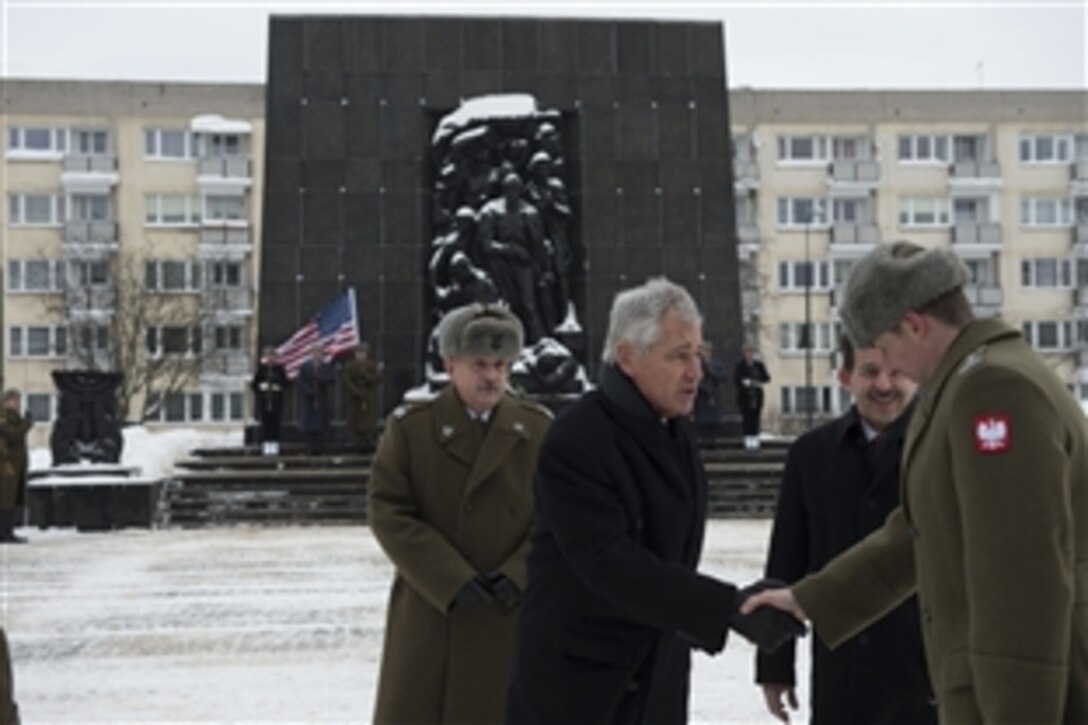 U.S. Defense Secretary Chuck Hagel meets Polish officials before laying a wreath at the Warsaw Ghetto in Warsaw, Poland, Jan. 31, 2014. Hagel is on a trip to Europe to meet with defense leaders and attend the 50th Munich Security Conference.