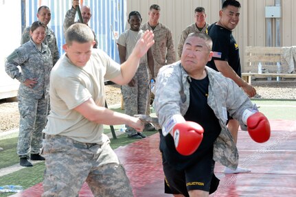 Spc. James Niederhauser and Sgt. 1st Class Christopher Max, both Texas Army National Guard members with Task Force Raptor, 3rd Squadron, 124th Cavalry Regiment, battle it out during clinch drills at a Modern Army Combatives Level-One Instructor Course. The Texas National Guard members hosted the course, March 12-16 at Camp Lemonnier, Djibouti.