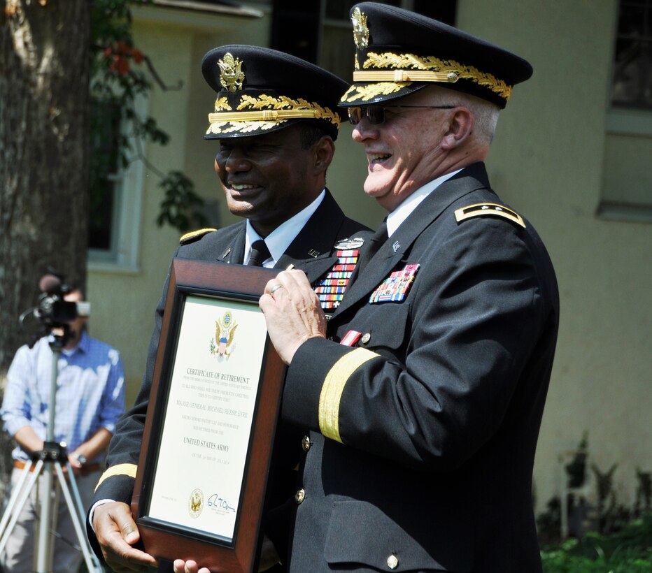 Lt. Gen. Thomas Bostick, U.S. Army Chief of Engineers, presents Maj. Gen. Michael Eyre with his certificate of retirement.