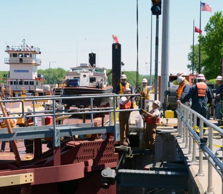 Crew members from St. Paul and Rock Islands districts install a temporary gate at Lock and Dam 5A, near Minnesota City, Minn., May 23, 2013. Since 2009, delays and interruptions have more than doubled on the nation's inland waterway locks and dams.