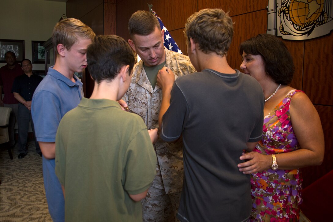 Lt. Col. Lance Langfeldt is promoted to his current rank in the commanding general's conference room aboard Marine Corps Recruit Depot San Diego, July 1. Langfeldt was promoted by Brig. Gen. James Bierman, commanding general of MCRDSD. 