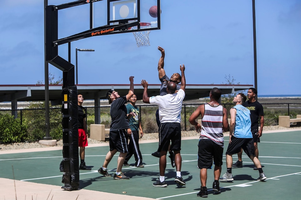 Marines with 11th Marine Expeditionary Unit, I Marine Expeditionary Force, play basketball at the 11th MEU field meet aboard Camp Pendleton, Calif., June 27, 2014. The Marines were celebrating the completion of their pre-deployment training.