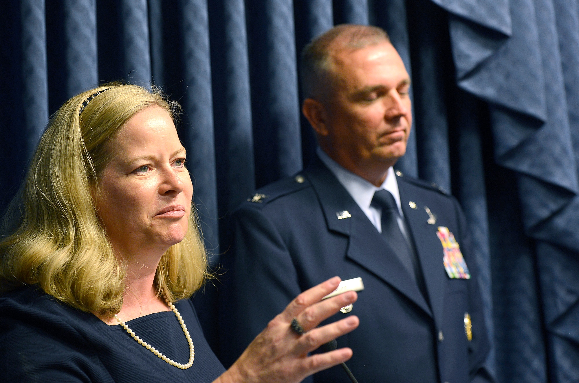 Charlotte Rupp speaks with her husband, Col. Ricky Rupp, after they received the 2013 General and Mrs. Jerome F. O'Malley Award June 27, 2014, during a Pentagon ceremony.  Rupp is the special assistant to the commander at U.S./Republic of Korea Combined Forces Command at U.S. Army Garrison Yongsan.  The award was earned during the Rupps' time while leading the 22nd Air Refueling Wing at McConnell Air Force Base, Kan.  (U.S. Air Force photo/Scott M. Ash)