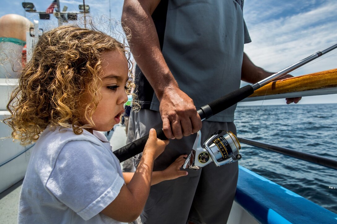 Major, 4, reels in a catch during a youth fishing trip aboard the fishing vessel Dana Pride June 26, 2014. More than 30 service members and children participated in the event. (U.S. Marine Corps photo by Cpl. Emmanuel Ramos/Released)