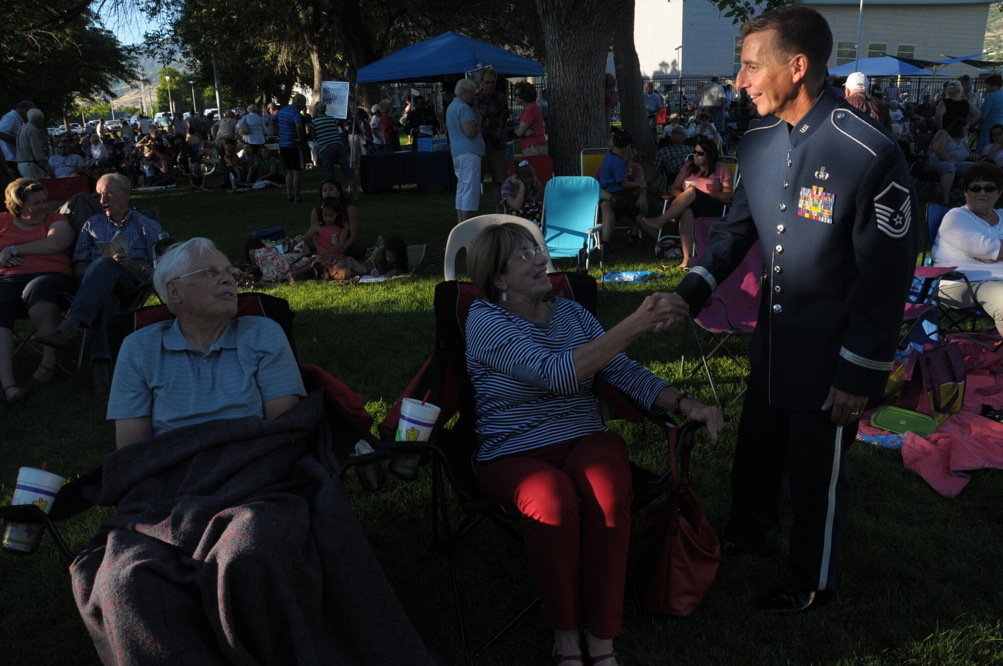 U.S. Air Force Master Sgt. Gerald Lockwood with the Air National Guard band of the West Coast talks to audience members at their performance in Bountiful City Park in Bountiful, Utah on June 30, 2014. (U.S. Air National Guard photo by Airman 1st Class Madeleine Richards/Released)
