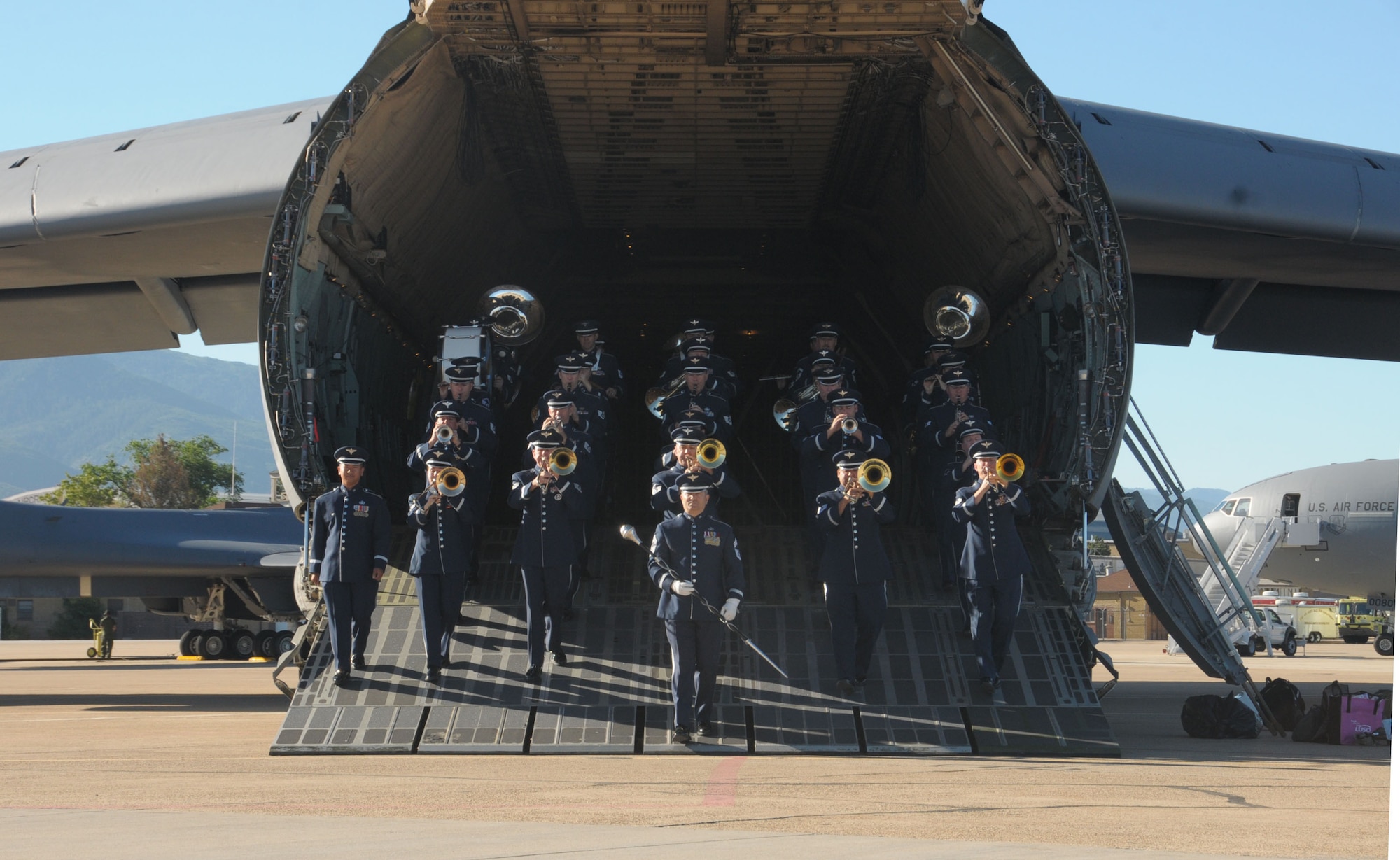 The Air National Guard Band of the West Coast marches out of a C-5 Galaxy at Hill Air Force Base in Layton, Utah on June 30, 2014. (U.S. Air National Guard photo by Airman 1st Class Madeleine Richards/Released)


