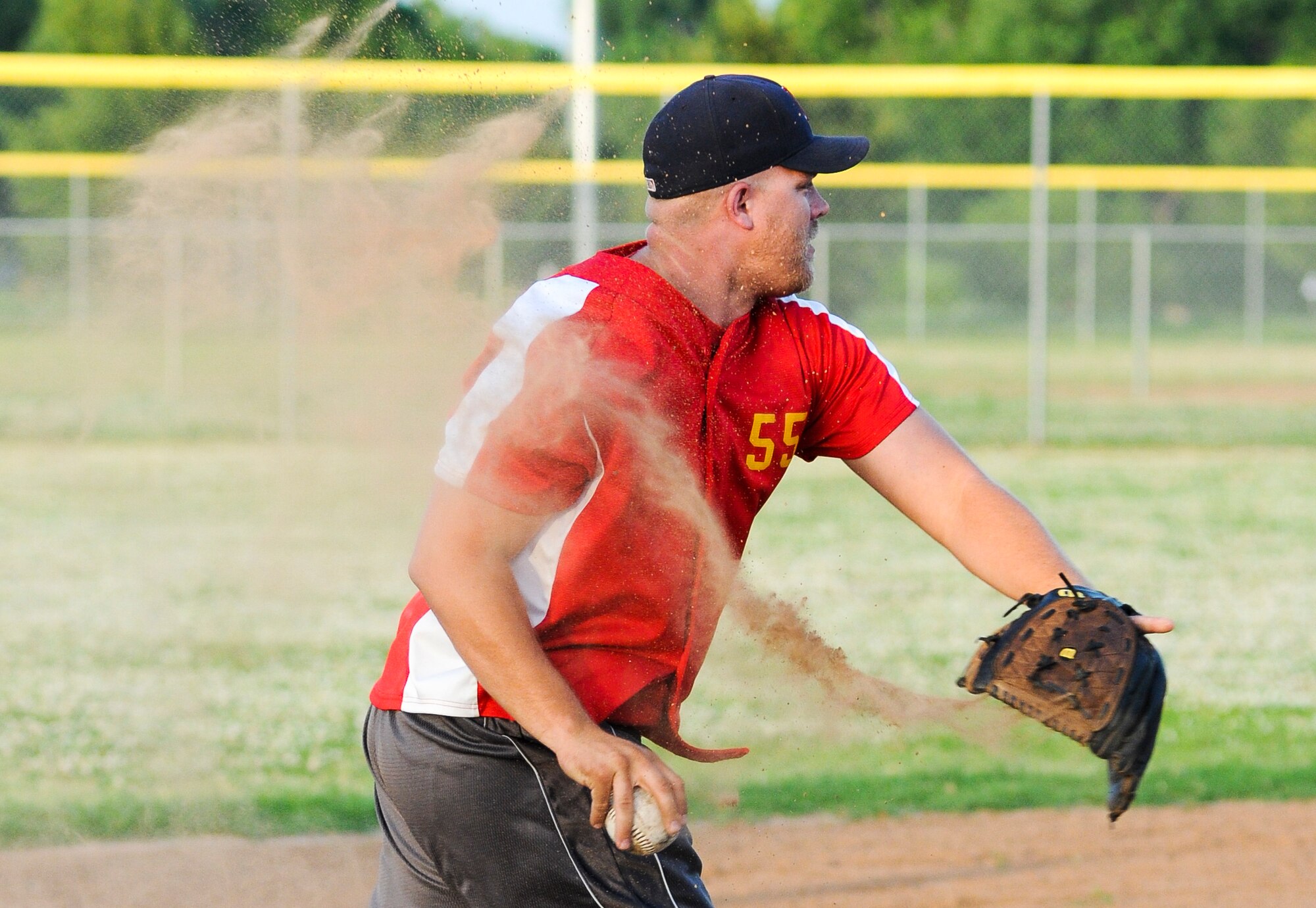 Okies' Dustin Staude comes up throwing from third base during a double header with Navy's VQ-7 Roughnecks Thursday June 26 at Tinker AFB.  The Okies came up short in the twin bill falling to the Roughnecks 14-0 in both games.  (U.S. Air Force photo/Senior Airman Mark Hybers)