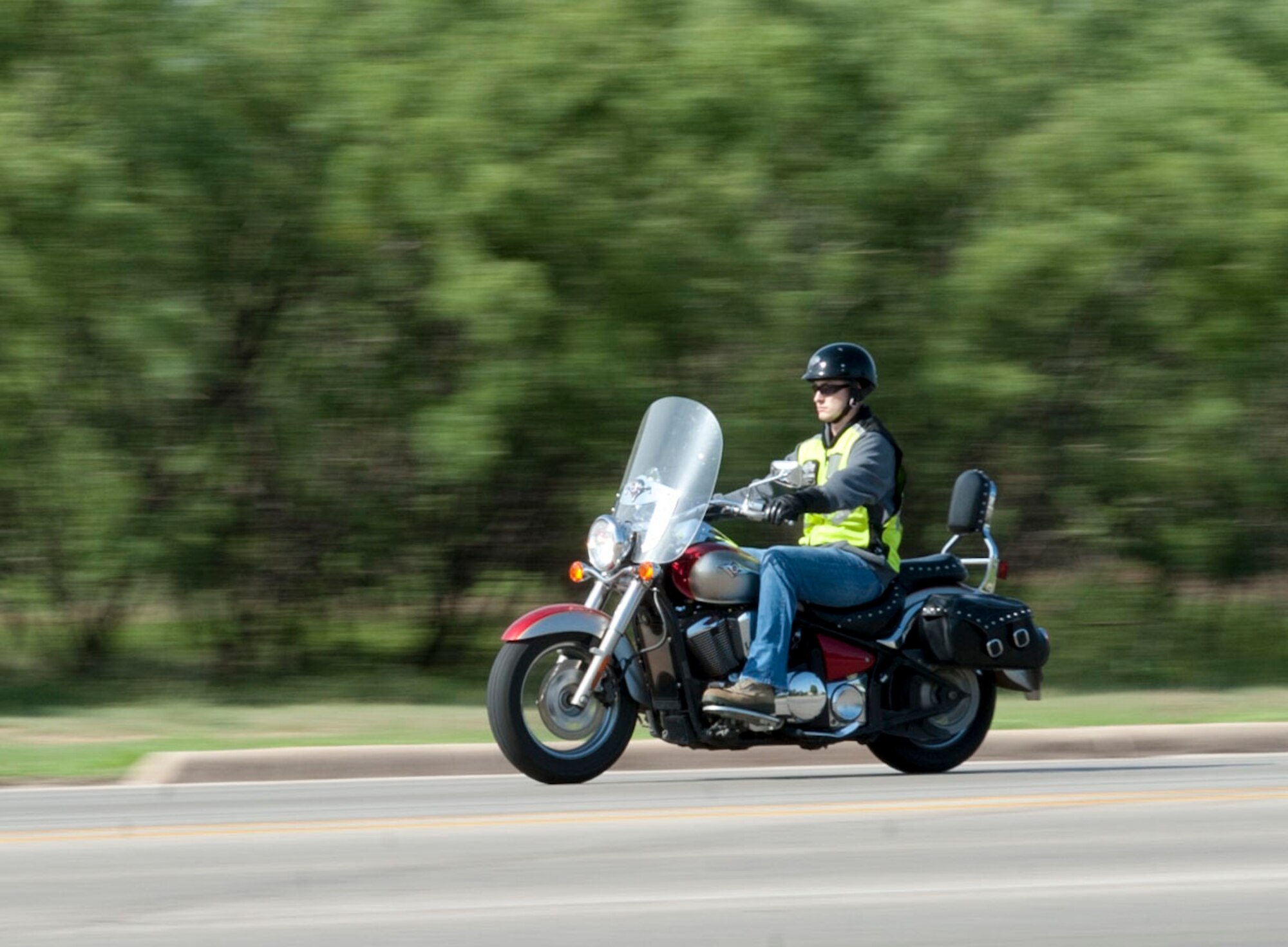 A man rides his motorcycle on June 19, 2014, on Dyess Air Force Base, Texas. Motorcycle safety is a major focus during the critical days of summer. Riders must be registered through the base safety office to ride their motorcycles on a military installation and follow proper safety procedures before riding. Riders should ensure to wear proper protective gear and follow their safety checklist prior to going on a motorcycle ride. (U.S. Air Force photo by Airman 1st Class Kylsee Wisseman/Released) 