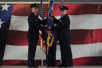 Col.David S. Drichta (right) accepts the 12th Operations Group guidon from Col. Matthew C. Isler, Commander, 12th Flying Training Wing, Joint Base San Antonio-Randolph, Texas, during an Assumption of Command Ceremony June 30. These ceremonies represent the formal passing of responsiblity, authority and accountablility of command from one officer to another. (U.S. Air Force photo by Desiree Palacios.
