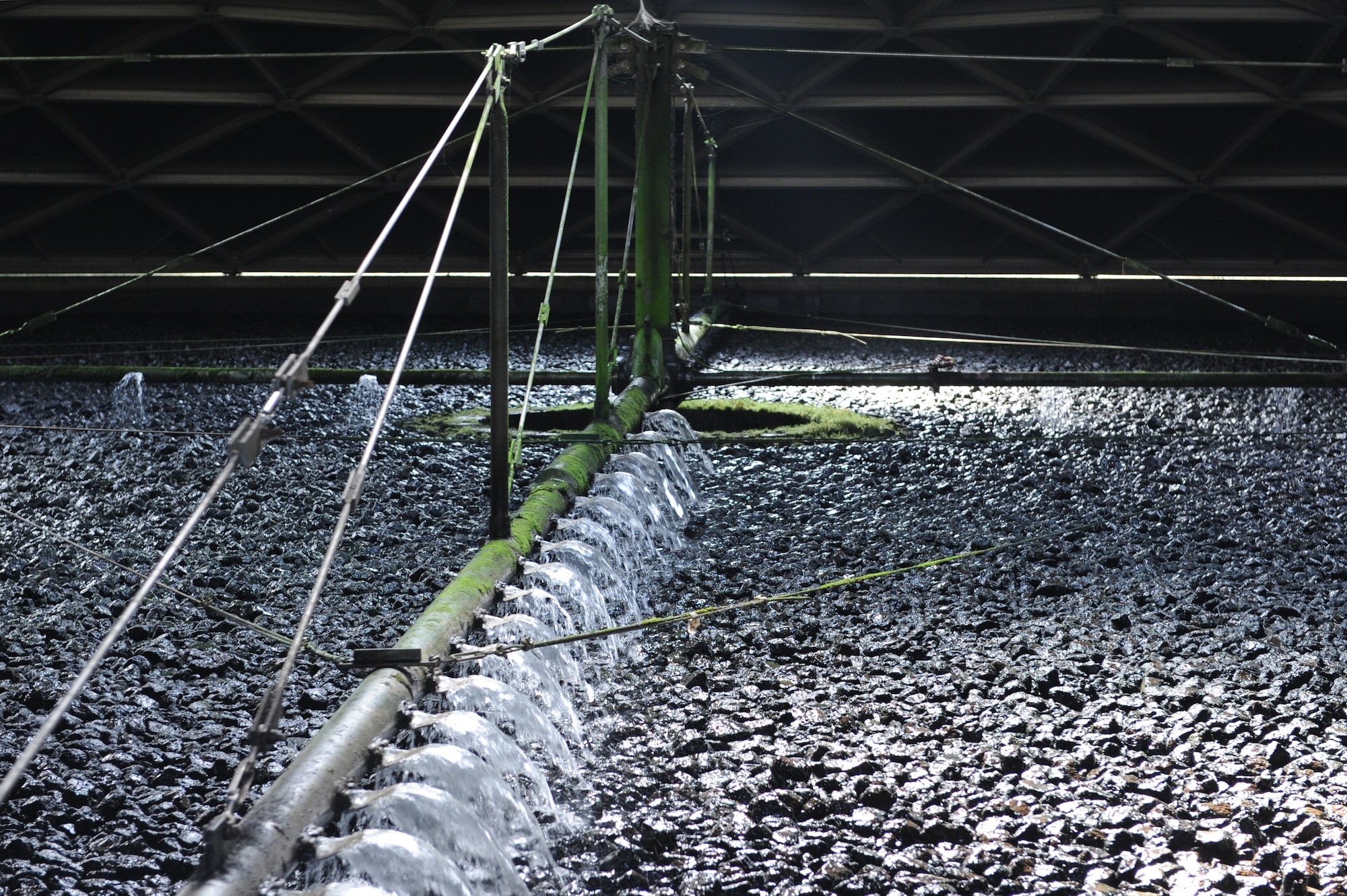 Rocks are used to filter base water at the waste water treatment plant at Scott Air Force Base, Ill. on June 23, 2014. These rocks are the second in a three step process to create usable water from waste water. (U.S. Air Force photo by Senior Airman Sarah Hall-Kirchner/Released)