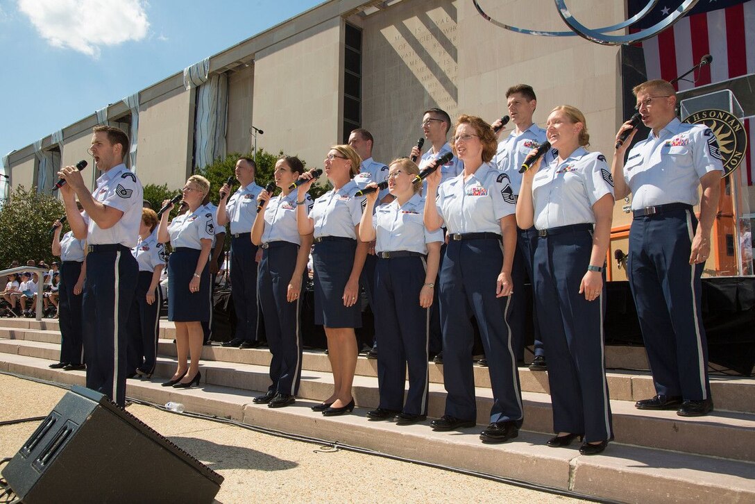 Technical Sgt. Daniel Anderson solos on "The Last Full Measure of Devotion" in front of the Singing Sergeants at the Smithsonian's National Museum of American History on June 14, Flag Day. This was part of a pre-concert for the Raise It Up! event,  celebrating the 200th Anniversary of the Star-Spangled Banner. The celebration culminated with a nation-wide sing-along of the National Anthem. (Photo from the Smithsonian Institution/released)
