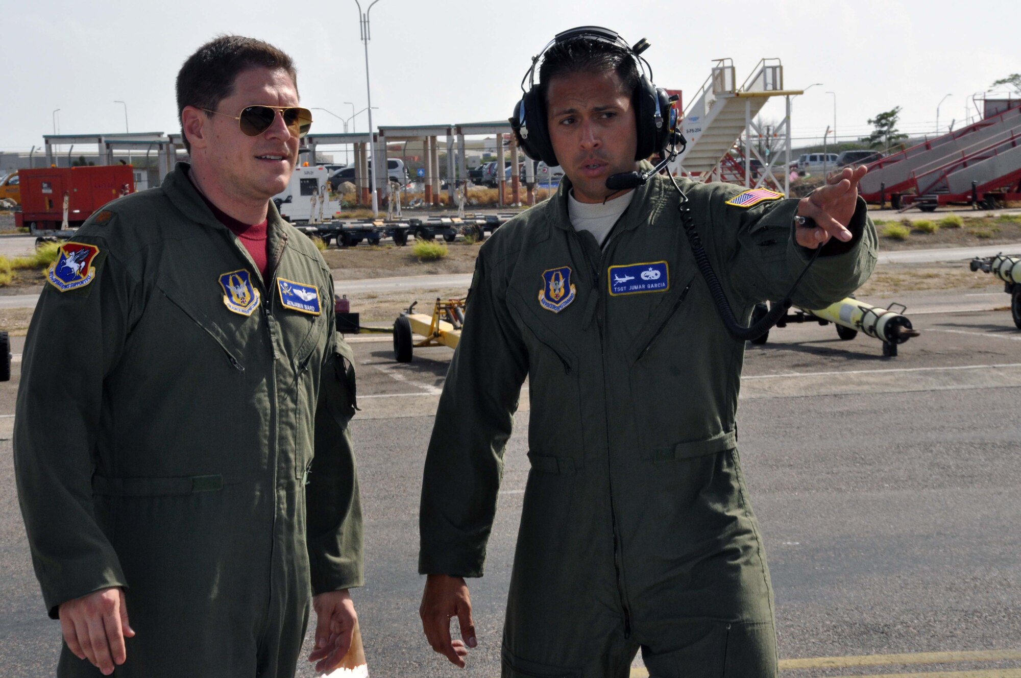 TSgt Jumar Garcia, 927 AMXS, briefs Maj Ben Ward, 63 ARS, on the condition of the aircraft before a humanitarian mission to Paraguay. Garcia and Ward were part of an eight-person crew that delivered donated material to Asuncion, Paraguay. (U.S. Air Force photo by Capt Joe Simms)