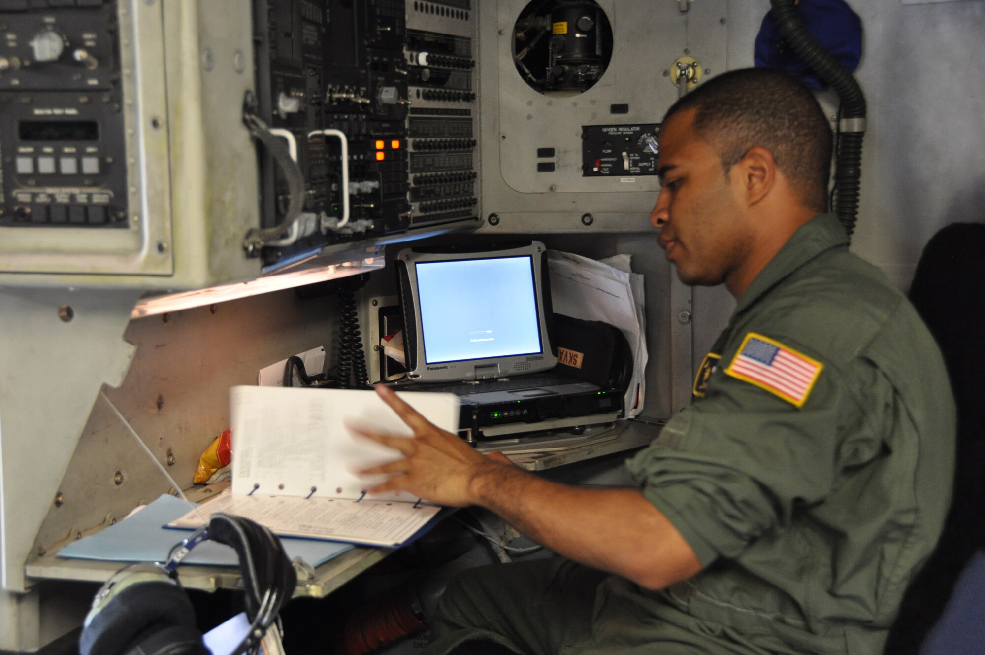 Tech. Sgt. Joe Poltor, a loadmaster with the 317th Airlift Squadron, Joing Base Charleston S.C. performs his duties on a C-17 Globemaster III.  (U.S. Air Force photo by Staff Sgt. Bobby Pilch)