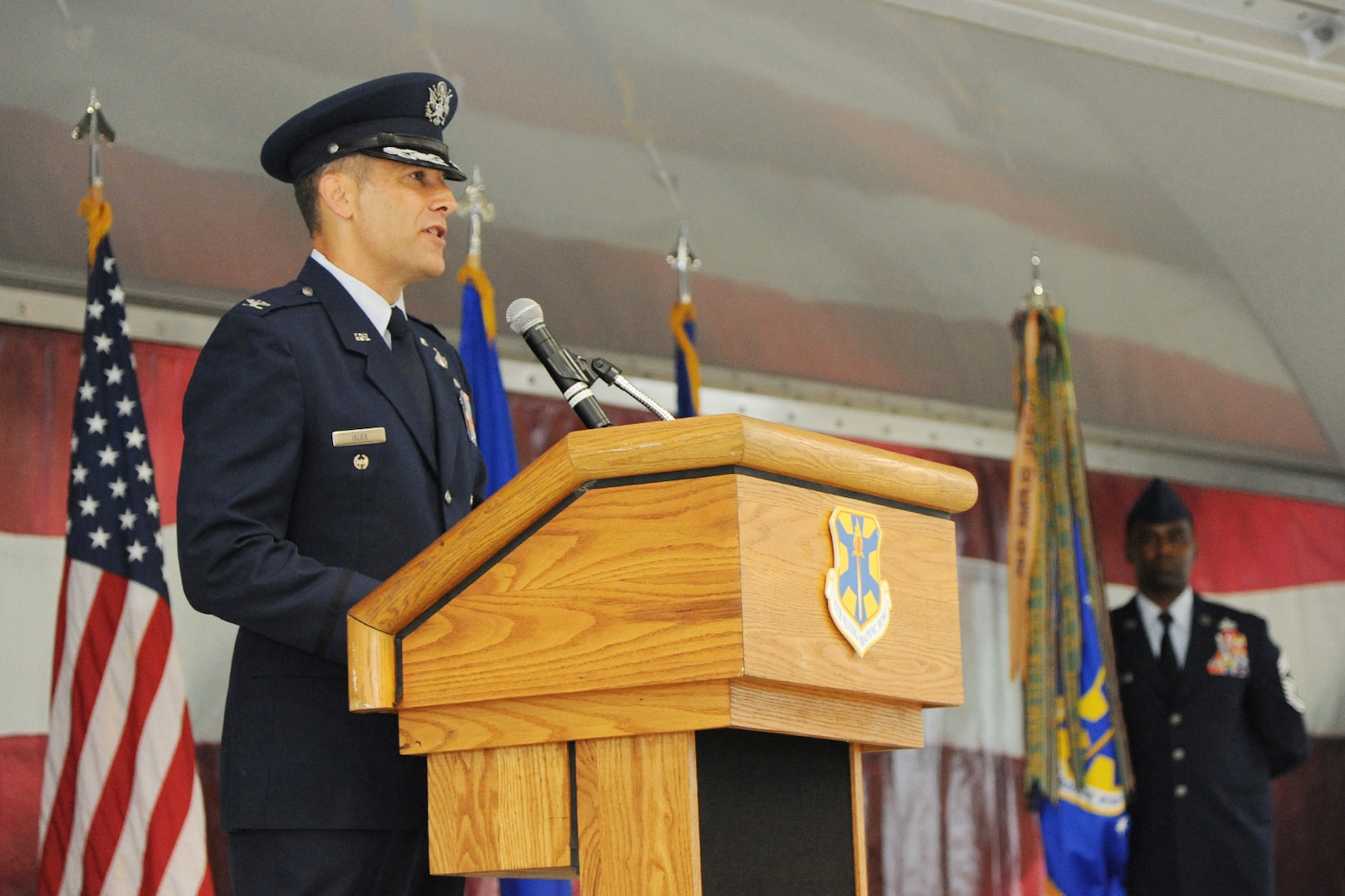 Col. Matthew C. Isler speaks to attendees of the 12th Flying Training Wing change of command cereemony, Joint Base San Antonio-Randolph, Texas, June 25.  These ceremonies represent the formal passing of responsiblity, authority and accountablility of command from one officer to another. (U.S. Air Force photo by Melissa Peterson)