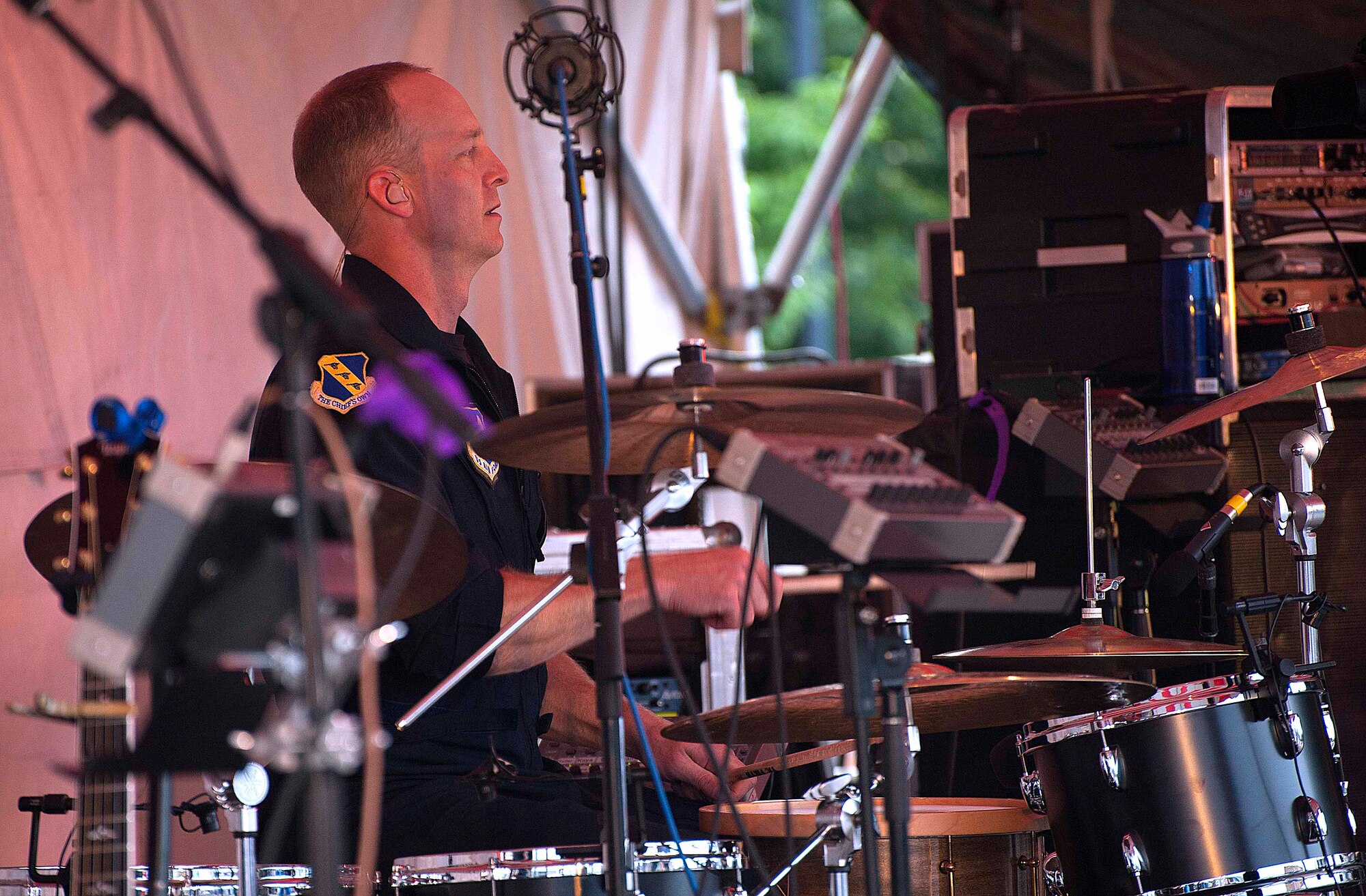 Senior Master Sgt. Dennis Hoffman, drummer for the U.S. Air Force band Max Impact, concentrates as he plays a rhythm for a song July 27 during a concert in the Depot Square in Cheyenne, Wyo. (U.S. Air Force photo by Airman 1st Class Brandon Valle)