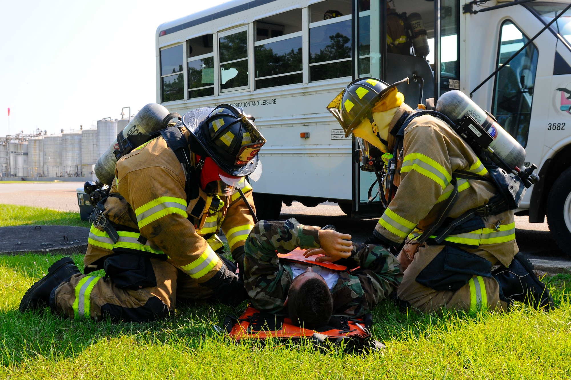 Georgetown County Fire/EMS first responders secure a simulated victim onto a stretcher during a bus crash scenario at a local company in Georgetown, S.C., June 5, 2014.  Georgetown County first responders and South Carolina National Guard Soldiers and Airmen are working side-by-side with the S.C. Emergency Management Division, to effectively respond to any hurricane that may threaten the state. The exercise is based on a hurricane post-landfall response between federal, state and local agencies, which includes training in communications, first responder skills, with the focus on how to better protect and assist citizens during emergency situations.  (U.S. Air National Guard photo by Tech. Sgt. Jorge Intriago/Released)

