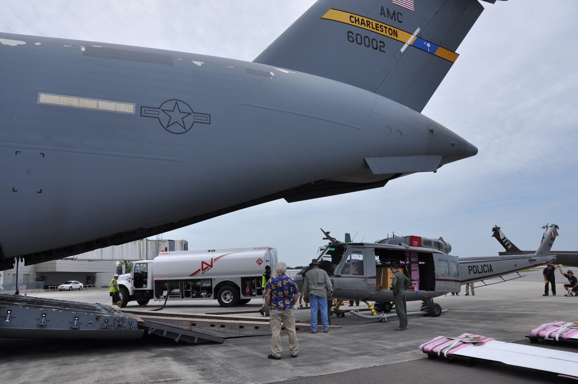 Airmen from the 317th Airlift Squadron, Joint Base Charleston, S.C. load a helicopter into the cargo bay of a C-17 Globemaster III. (U.S. Air Force photo by Staff Sgt. Bobby Pilch)
