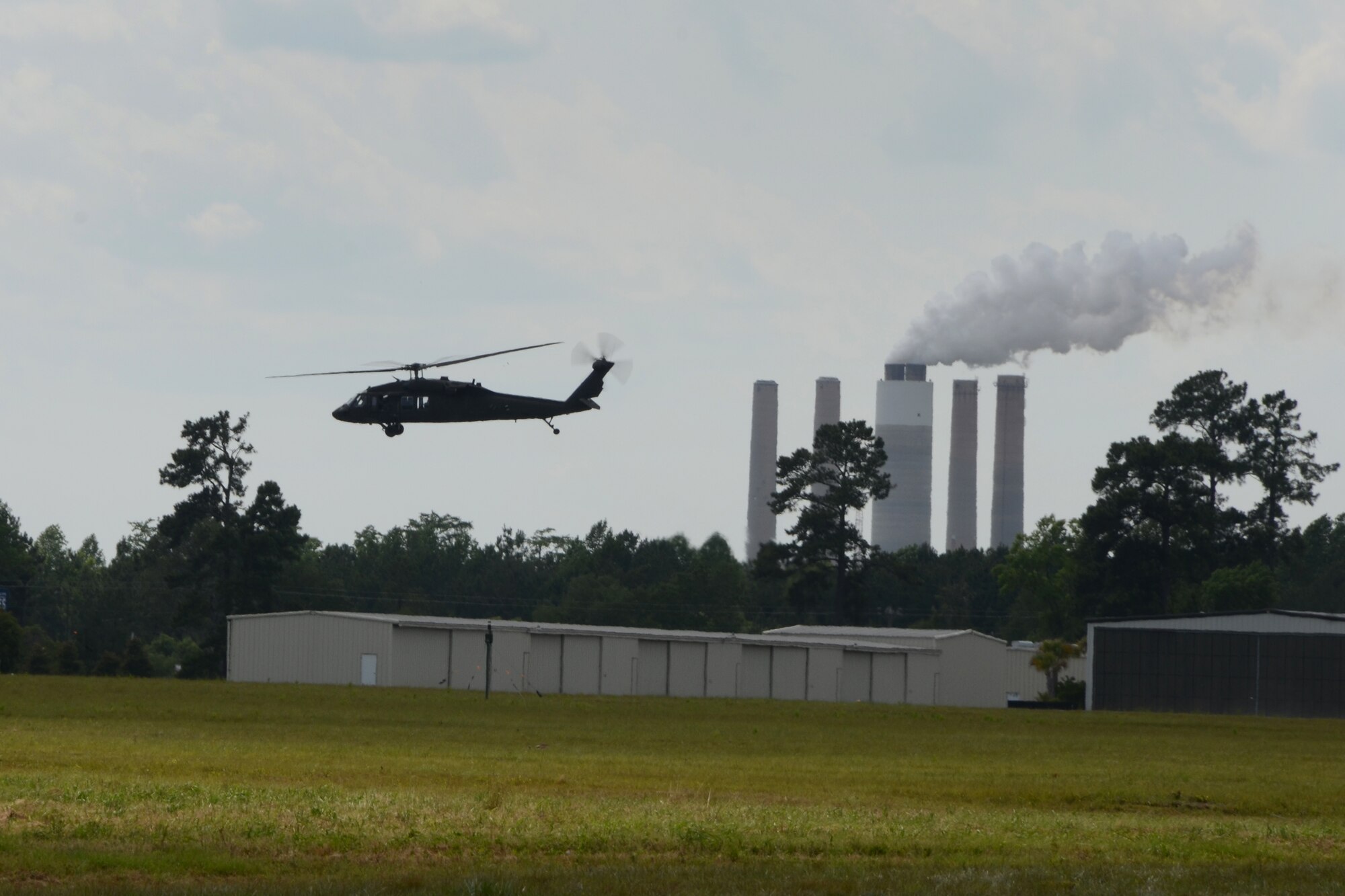 A UH-60 Blackhawk helicopter, supporting the South Carolina Helicopter Aquatic Rescue Team (SC-HART) from the South Carolina Army National Guard, leaves the exercise area at the Georgetown County Airport on June 3, 2014 to participate in a hurricane preparedness exercise with local emergency first responders to kick-off the first week of the hurricane season. Soldiers and Airmen from the South Carolina National Guard work side-by-side with the S.C. Emergency Management Division and first responders from local emergency agencies to effectively respond to any hurricane that may threaten the state. The exercise scenario involved a hurricane post-landfall response between federal, state and local agencies, which includes training in communications and first responder skills, with a focus on how to better protect and assist citizens during emergency situations. (U.S. Air National Guard photo by Senior Master Sgt. Edward Snyder/Released)