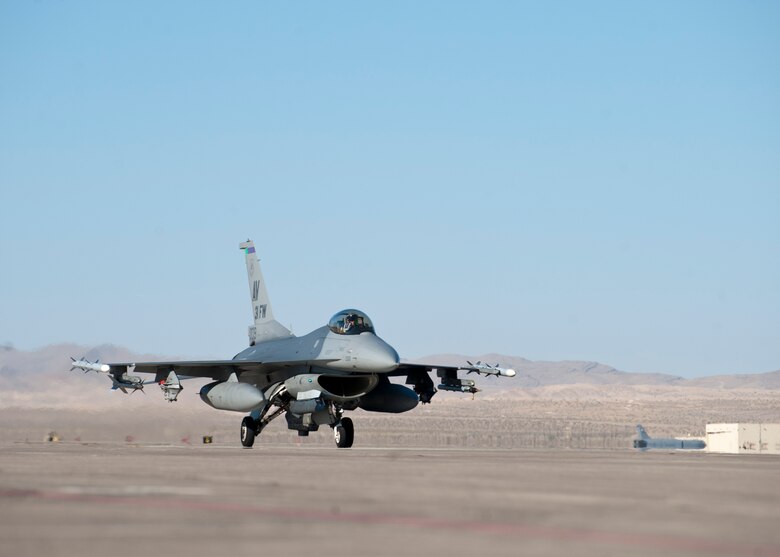 A U.S. Air Force F-16 Fighting Falcon from the 31st Fighter Wing, Aviano Air Base, Italy, taxis on the flightline during Green Flag West 14-8, June 26, 2014, at Nellis Air Force Base, Nev. The F-16 is a super-sonic multirole fighter aircraft capable of carrying six air-to-air missiles, conventional air-to-air and air-to-surface munitions, and electronic countermeasure pods. (U.S. Air Force photo by Airman 1st Class Thomas Spangler)