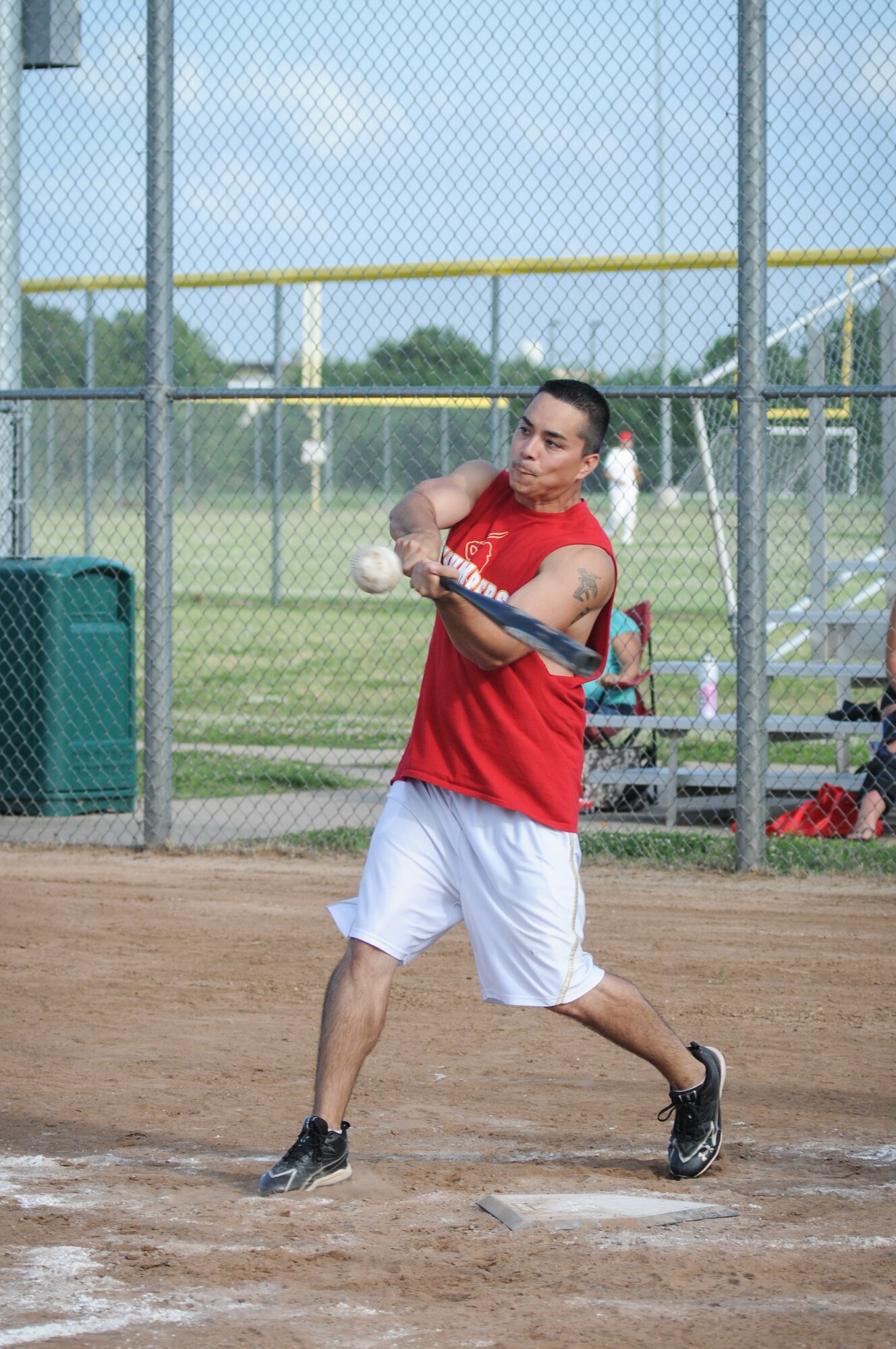 Master Sgt. Thomas Carter, a first sergeant with the 513th Aircraft Maintenance Squadron, sends a ball to the outfield during the Thumper’s first softball game of the season June 26 at Tinker Air Force Base, Oklahoma. Carter batted two home runs and scored a .833 on-base percentage during the evening’s two games. (U.S. Air Force Photo/Staff Sgt. Caleb Wanzer)