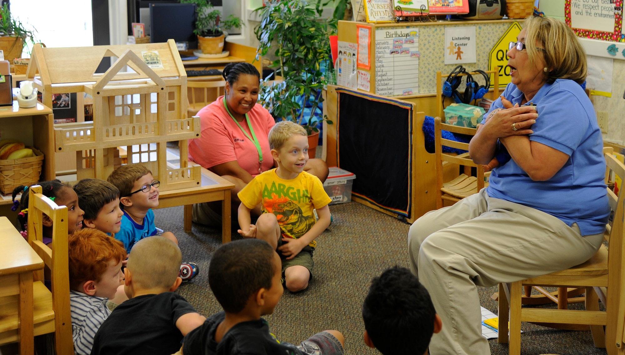 Nora Torres, preschool teacher, teaches children about taking care of babies during a class at the main child development center on Hurlburt Field, Fla., June 25, 2014. Torres has three children of her own and said she loves teaching. (U.S. Air Force photo/Staff Sgt. Sarah Hanson)