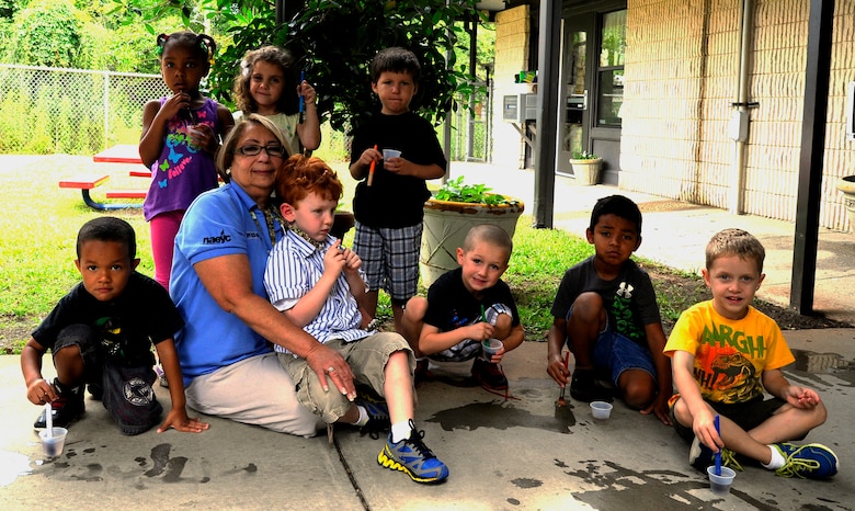 Children playing in a quality childcare environment.^[[Image](https://www.hurlburt.af.mil/News/Features/Display/Article/495550/hurlburt-cdc-teacher-inspires-children-for-29-years/) by [Hurlburt Field](https://www.hurlburt.af.mil/) is in the public domain]