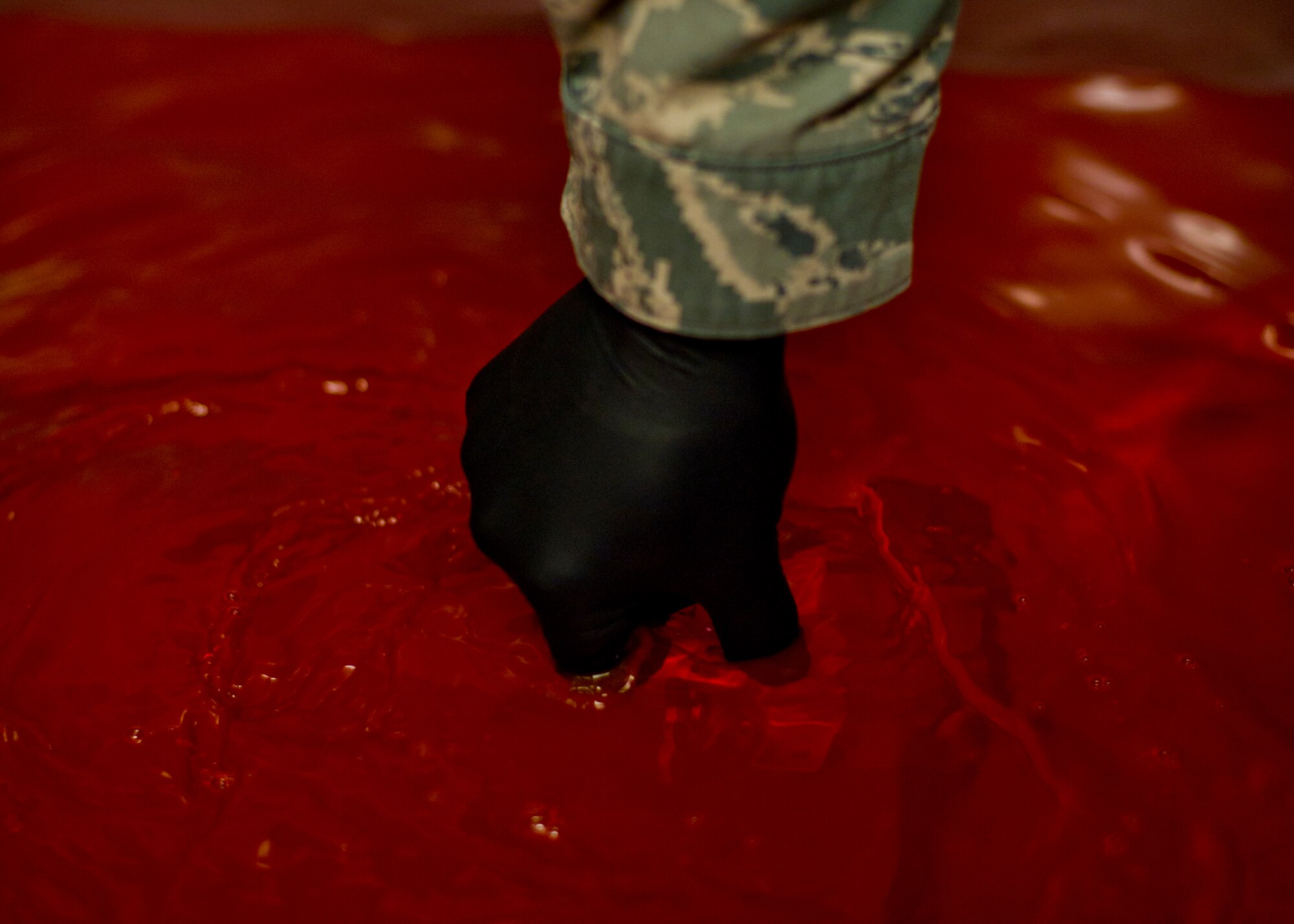 Senior Airman Roderick Johnson, 49th Maintenance Squadron non-destructive inspection technician, prepares a metal bracket for inspection by dipping it in a penetrant at Holloman Air Force Base, N.M., June 30. The item is dipped in a very low viscosity penetrant which fills any voids left by cracks or damage and indicates a need for repair. NDI technicians are able to assist aircraft maintainers by identifying aircraft damage, allowing them to ensure military aviation equipment safety. (U.S. Air Force photo by Airman 1st Class Aaron Montoya / Released)