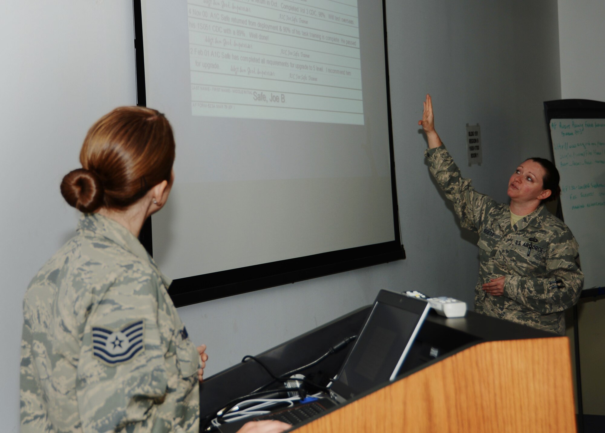 Master Sgt. Sabrina Wiggett teaches an Air Force training course for Airmen in the 103rd Maintenance Squadron with Tech. Sgt. Amy Robison (foreground) at the Combat Readiness Training Center, Gulfport, Miss., June 25, 2014. The Airmen from the Connecticut Air National Guard deployed to the CRTC to conduct training with the Kentucky Air National Guard's 123rd Maintenance Group. (U.S. Air National Guard photo by Senior Airman Jennifer Pierce)