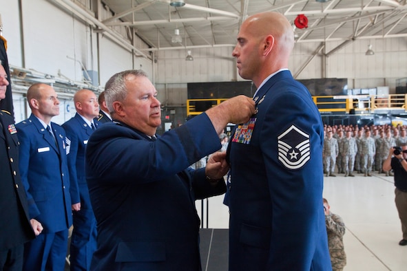 A picture of Brig. Gen. Michael L. Cunniff the adjutant general of New Jersey, presenting Master Sgt. Michael F. Sears, 177th Fighter Wing, the Silver Star.