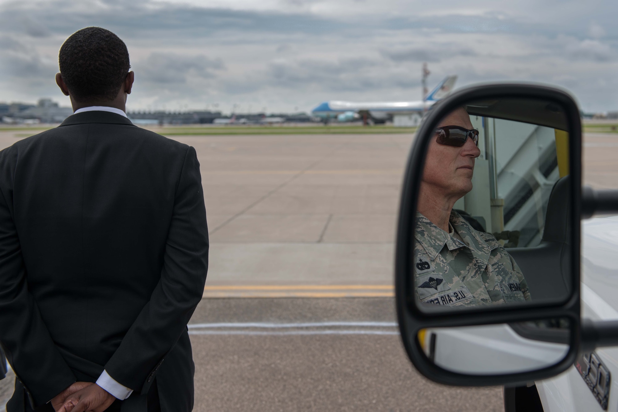 Tech. Sgt. Scott R. Tammen, 27th Aerial Port Squadron, waits with the mobile staircase as Air Force One taxis in to the 934th Airlift Wing at Minneapolis St. Paul International Airport Air Reserve Station. (Air Force Photo/Staff Sgt. Trevor Saylor)