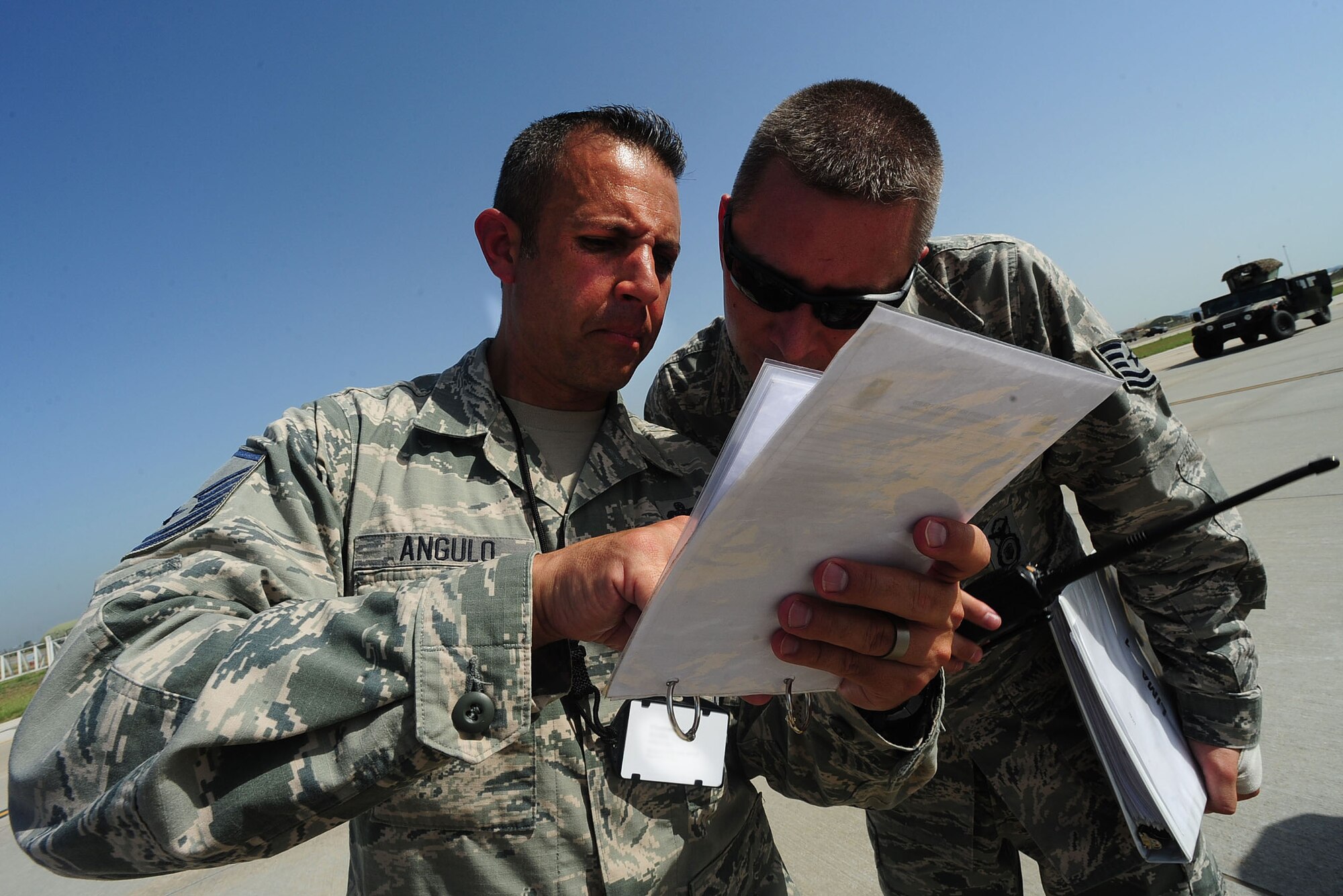 Master Sgt. Alexander Angulo, 39th Security Forces Squadron NCO in charge of installation security, reads a checklist during an exercise June 27, 2014, Incirlik Air Base, Turkey. Airmen at Incirlik AB participate in exercises to ensure readiness for real world situations.(U.S. Air Force photo by Senior Airman Nicole Sikorski/Released)