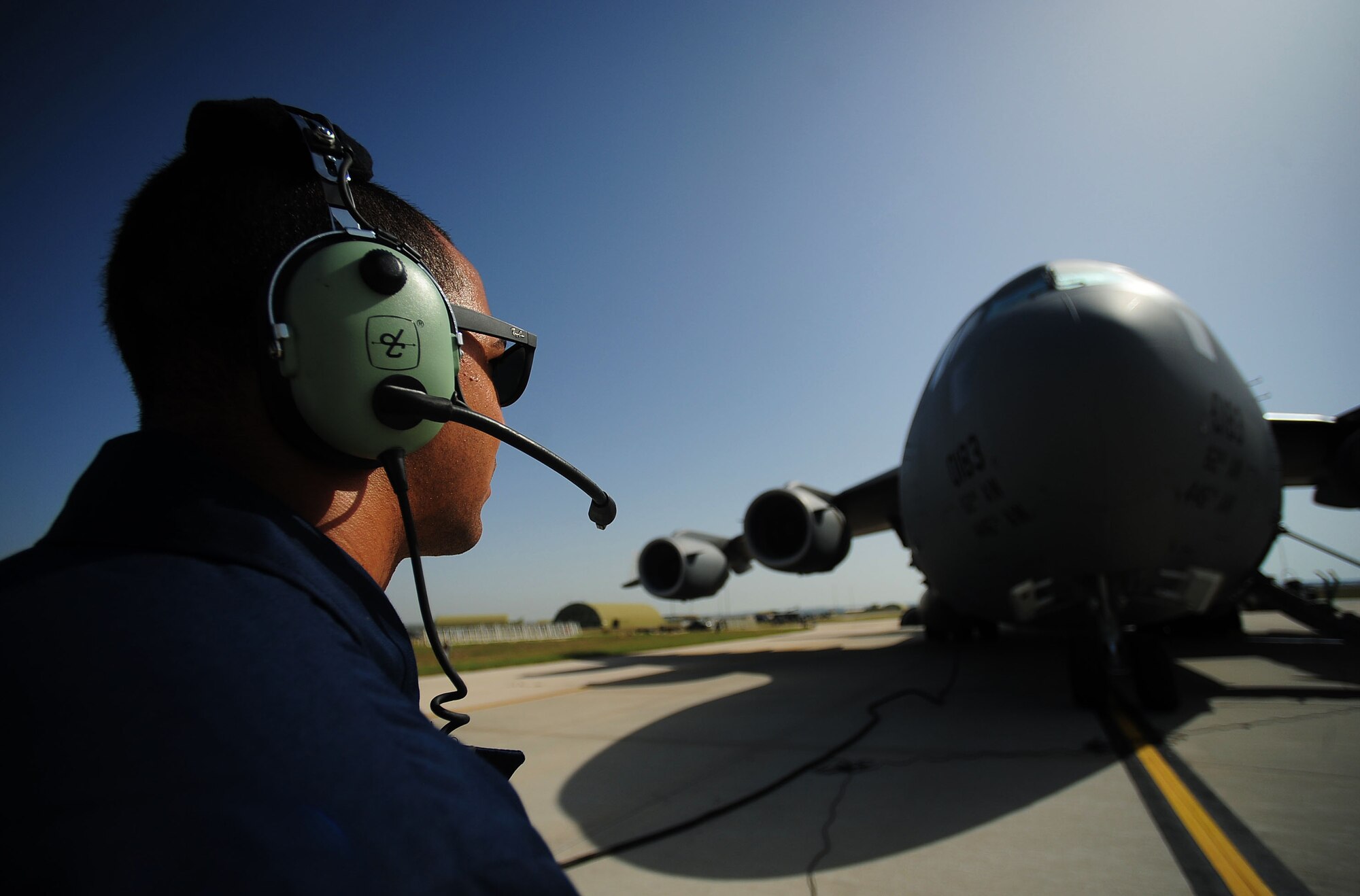 Senior Airman German Rubio-Arroyo, 39th Maintenance Squadron aerospace ground equipment journeyman, refuels a C-17 Globemaster cargo aircraft during a wing exercise June 27, 2014, Incirlik Air Base, Turkey. The exercise involved a variety of scenarios requiring responses and actions from a various base agencies to include the Security Forces, Civil Engineer and Maintenance Squadrons. (U.S. Air Force photo by Senior Airman Nicole Sikorski/Released)