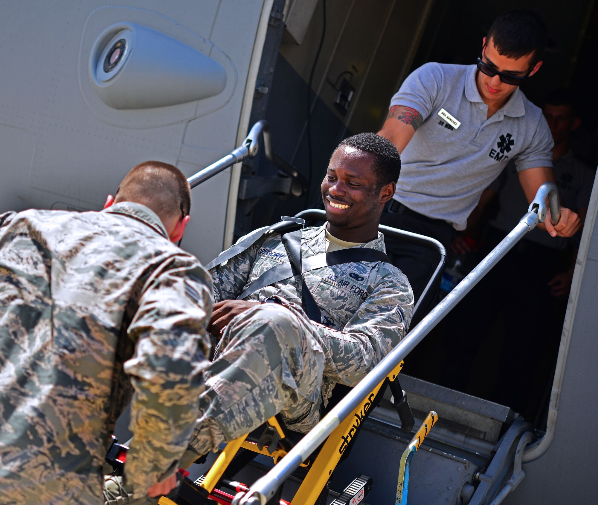 Airman 1st Class Deon Gregory, 39th Security Forces Squadron security response team member, is carried out of a C-17 Globemaster cargo aircraft during a wing exercise June 27, 2014, Incirlik Air Base, Turkey. Airmen at Incirlik AB participate in exercises to ensure readiness for real world situations. (U.S. Air Force photo by Senior Airman Nicole Sikorski/Released) 
