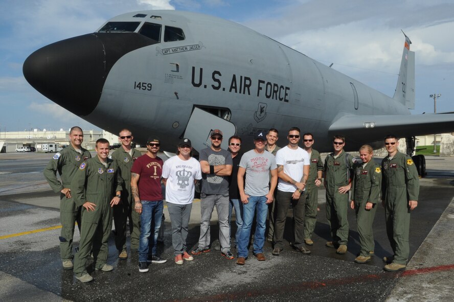 3 Doors Down poses for a group photo with members from the 909th Air Refueling Squadron and their commander, Lt. Col. Jack W. Flynt III, at Kadena Air Base, Japan, June 30, 2014. After performing at AmericaFest 2014 twice, the band was invited on an air refueling training mission to experience what the 909th ARS does. (U.S. Air Force photo by Airman 1st Class Zackary A. Henry)