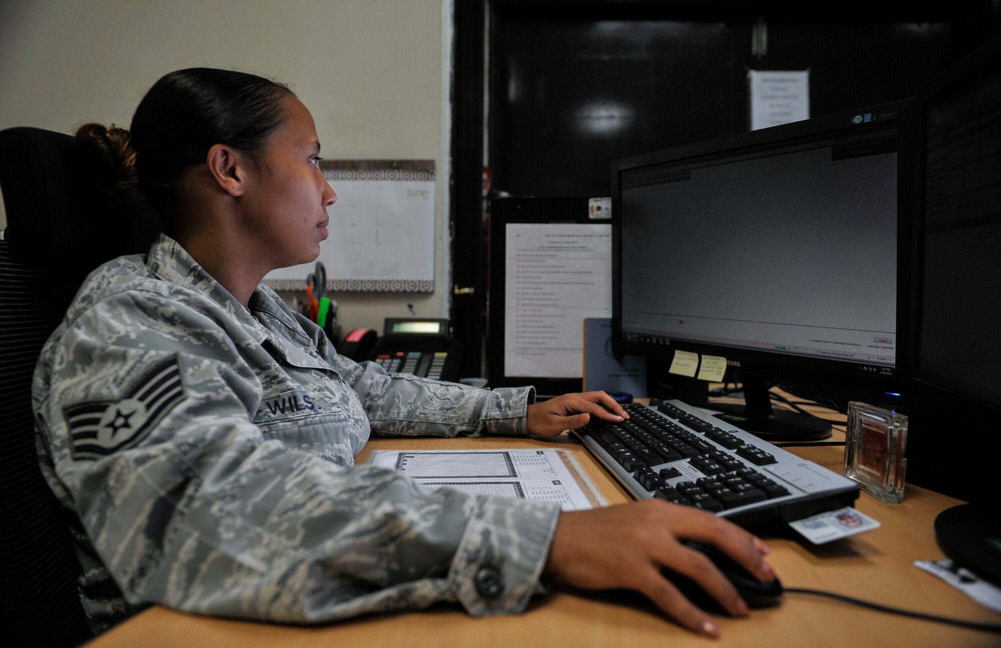 Staff Sgt. Brianna Wilson, 51st Maintenance Operations Flight aircraft documentation section NCO in charge, updates sortie progression slides on Osan Air Base, Republic of Korea, June 30, 2014. Wilson is this week’s Airman Spotlight winner. (U.S. Air Force photo/Senior Airman David Owsianka)