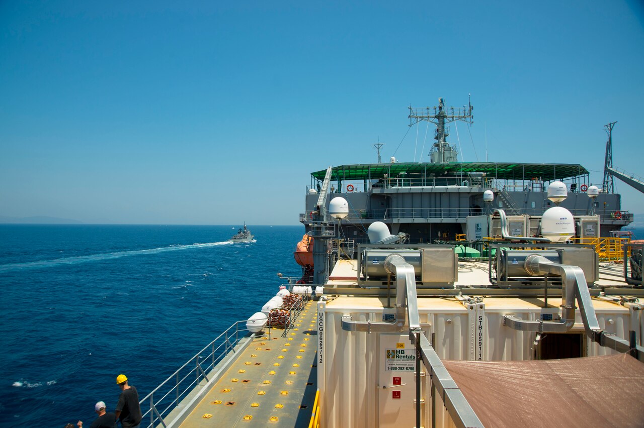 The Spanish patrol boat Infanta Elena, left, escorts the container ship MV Cape Ray through the Strait of Gibraltar en route to the Mediterranean Sea June 26, 2014. The U.S. government-owned MV Cape Ray was modified and deployed to the eastern Mediterranean Sea to dispose of Syrian chemical agents in accordance with terms Syria agreed to in late 2013. U.S. Navy photo by Mass Communication Specialist Seaman Desmond Parks