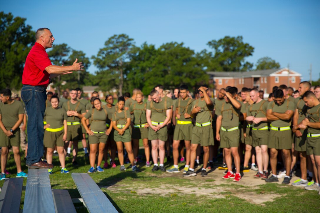 Charles Wood (left), a tactical safety specialist on Marine Corps Base Camp Lejeune, speaks to Marines with Supply Company, 2nd Supply Battalion, 2nd Marine Logistics Group about roadway dangers during a physical and alcohol awareness training session aboard Camp Lejeune, N.C., June 30, 2014. Wood used examples of recent traffic incidents to present the Marines with realistic scenarios they could encounter if they are not careful while driving.