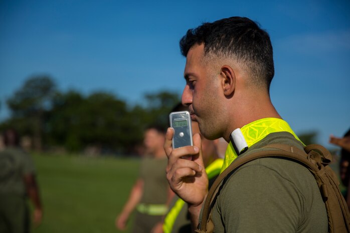 A Marine with Supply Company, 2nd Supply Battalion, 2nd Marine Logistics Group blows into a blood alcohol content calculator during a unit alcohol awareness and physical training session aboard Camp Lejeune, N.C., June 30, 2014. The unit’s command selected 12 Marines with different body types to demonstrate the effect alcohol has on the physical abilities and coordination of different people.