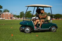 A Marine with Supply Company, 2nd Supply Battalion, 2nd Marine Logistics Group drives a golf cart along a figure-eight course during a unit alcohol awareness and physical training session aboard Camp Lejeune, N.C., June 30, 2014. Marines with the company drove the course with clear vision before donning beer goggles to simulate intoxication while several others drank alcohol for approximately 30 minutes before the exercise to demonstrate the effects of alcohol on a person’s ability to drive.