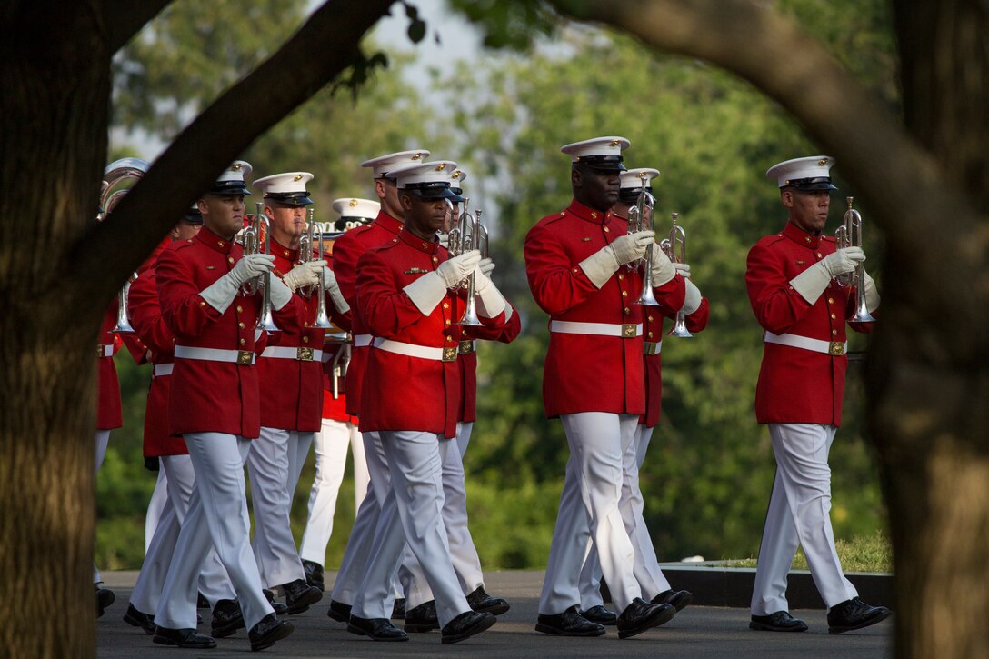 The United States Marine Drum & Bugle Corps performs during a Tuesday Sunset Parade at the Marine Corps War Memorial in Arlington, Va., July 1. (Official Marine Corps photo by Cpl. Larry Babilya/Released)