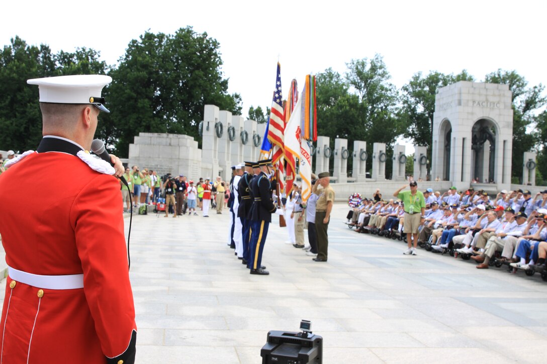 On July 2, 2014, baritone vocalist Master Sgt. Kevin Bennear and trumpet player Staff Sgt. Amy McCabe performed for an Honor Flight from Chicago at the World War II Memorial in Washington, D.C. (U.S. Marine Corps photo by Master Sgt. Kristin duBois/released)