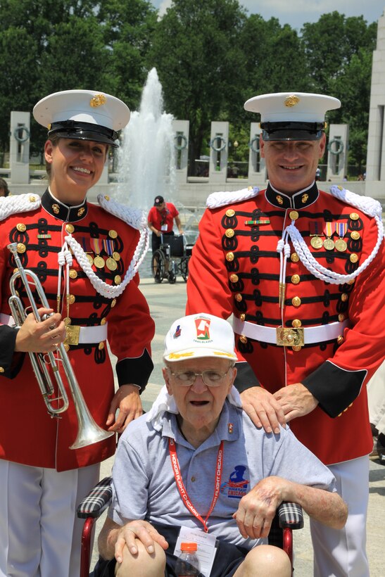 On July 2, 2014, baritone vocalist Master Sgt. Kevin Bennear and trumpet player Staff Sgt. Amy McCabe performed for an Honor Flight from Chicago at the World War II Memorial in Washington, D.C. (U.S. Marine Corps photo by Master Sgt. Kristin duBois/released)