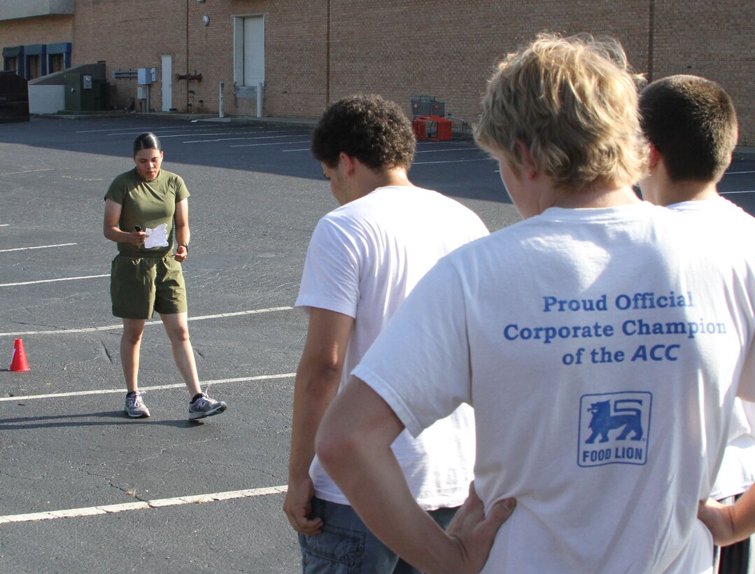 U.S. Marine Corps Pvt. Katherine L. Palacio, a recent recruit training graduate and Tucson, Ariz., native, leads poolees from Recruiting Sub-Station Greensboro, in physical training outside the sub-station’s office in Greensboro, N.C., June 12, 2014. Palacio battled for four years to join the Marine Corps before enlisting out of Greensboro, N.C., on Feb. 20, 2014, and finishing recruit training as part of platoon 4018, O Company, 4th Recruit Training Battalion, Marine Corps Recruit Depot Parris Island, S.C., June 6, 2014. (U.S. Marine Corps photo by Sgt. Dwight A. Henderson/Released)